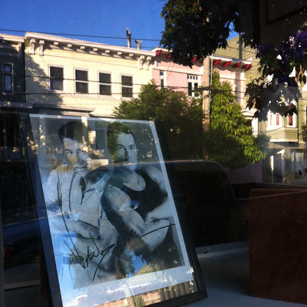 JCVD signed photo in the window of a barber shop in the Castro, SF