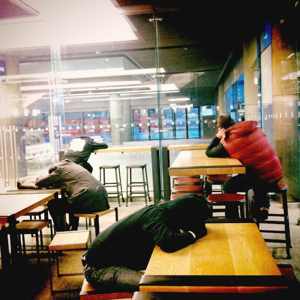 The Wait. People sleeping in a station cafe